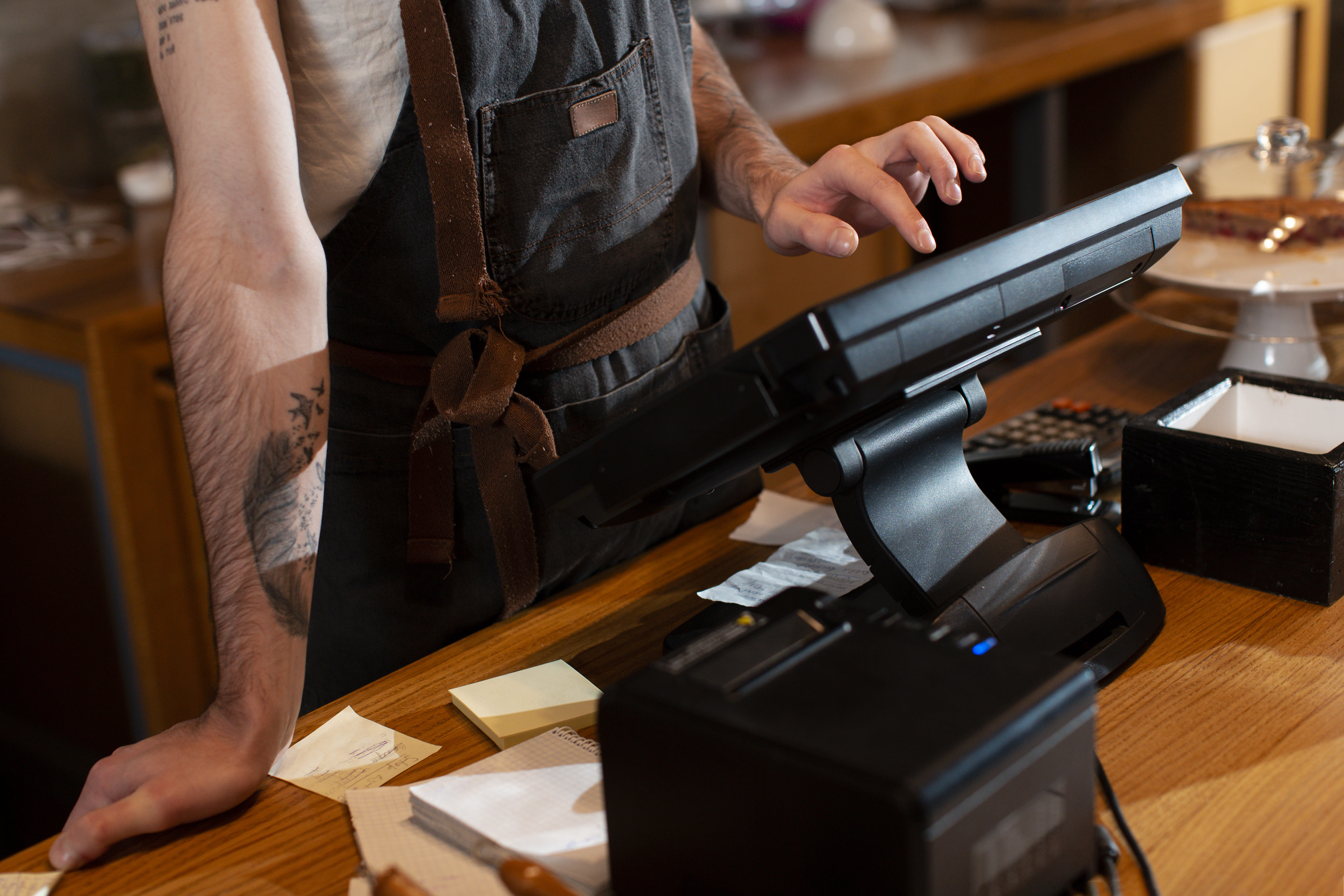 close-up-man-working-cash-register (1).jpg